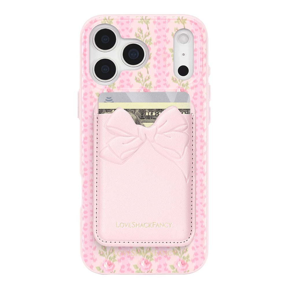 Pink floral phone case with cardholder and bow design on a white background
#color_pink