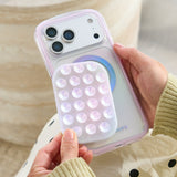 Phone case with bubble design held by a person #color_iridescent