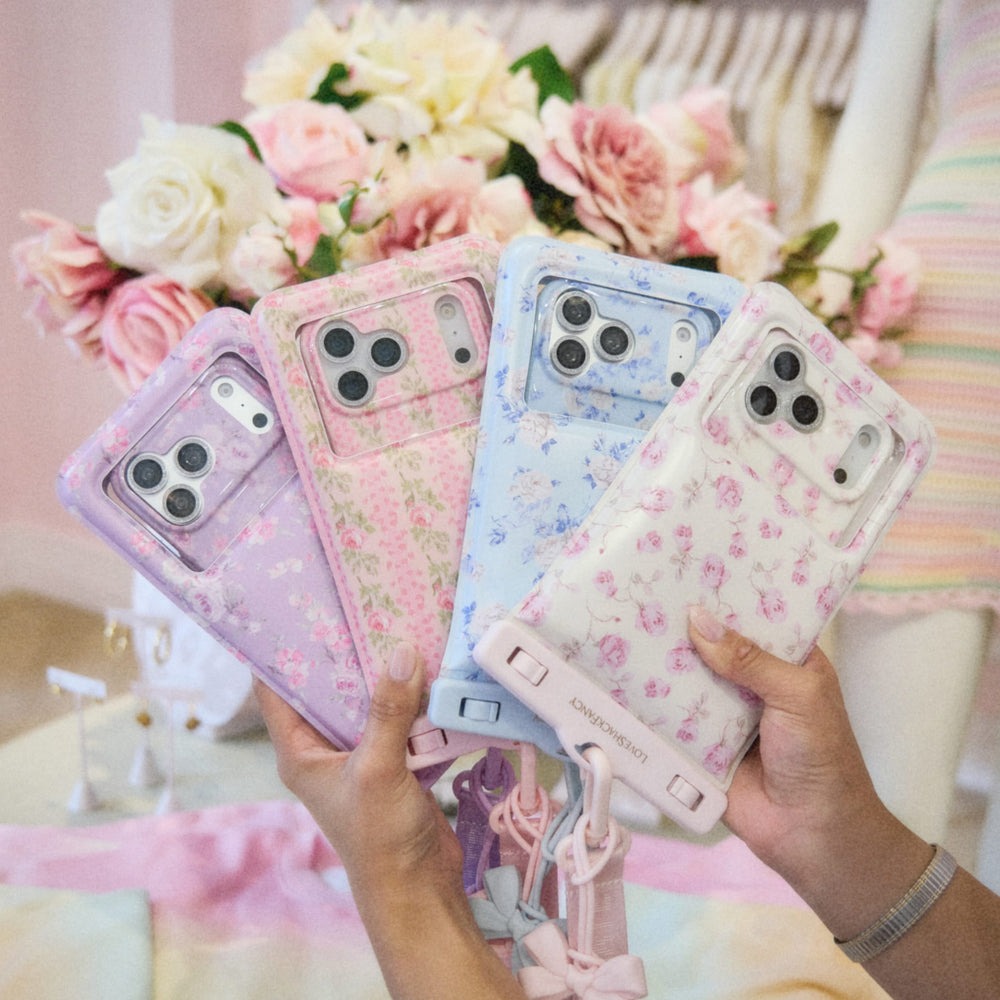 Four floral phone cases held by hands with a blurred floral background
#color_happy thoughts