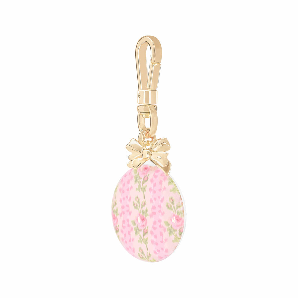 Pink floral keychain with gold clasp on a white background #color_blooming heirloom