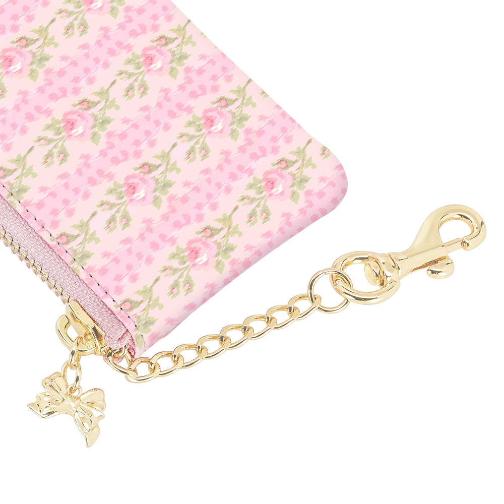 Pink floral wallet with gold chain and bow charm on a white background
#color_blooming heirloom