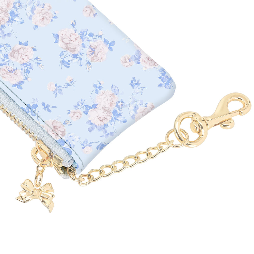 Floral-patterned pouch with gold chain and bow charm on a white background
#color_everblooming rosettes