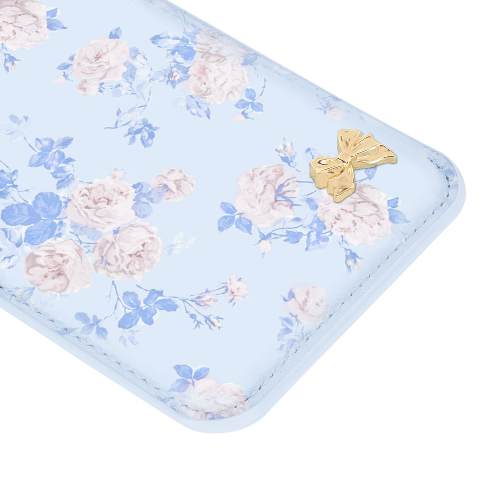 Floral-patterned product with a gold bow on a light blue background
#color_everblooming rosettes