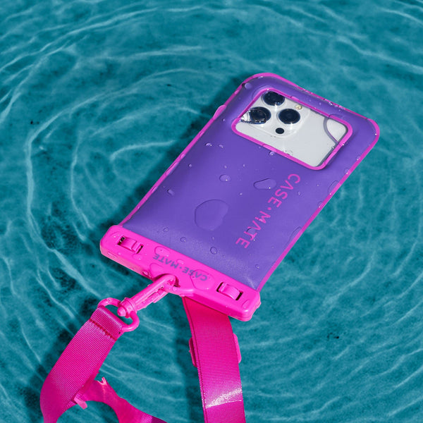Phone case with pink strap on a blue water background #color_purple paradise