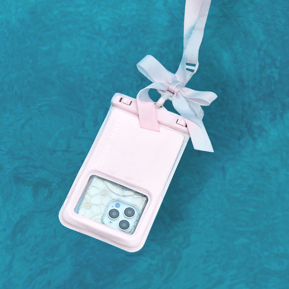 Phone case with a bow on a blue water background #color_ballet pink bow