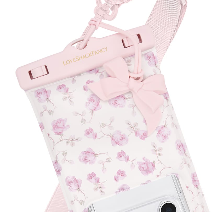 Floral-patterned pouch with pink bow and 'LOVE SHACK FANCY' branding on a white background
#color_ribbon rosa flora