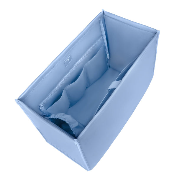 A light blue fabric organizer insert with zippered compartments, shown from an elevated angle on a white background.

#color_carolina blue