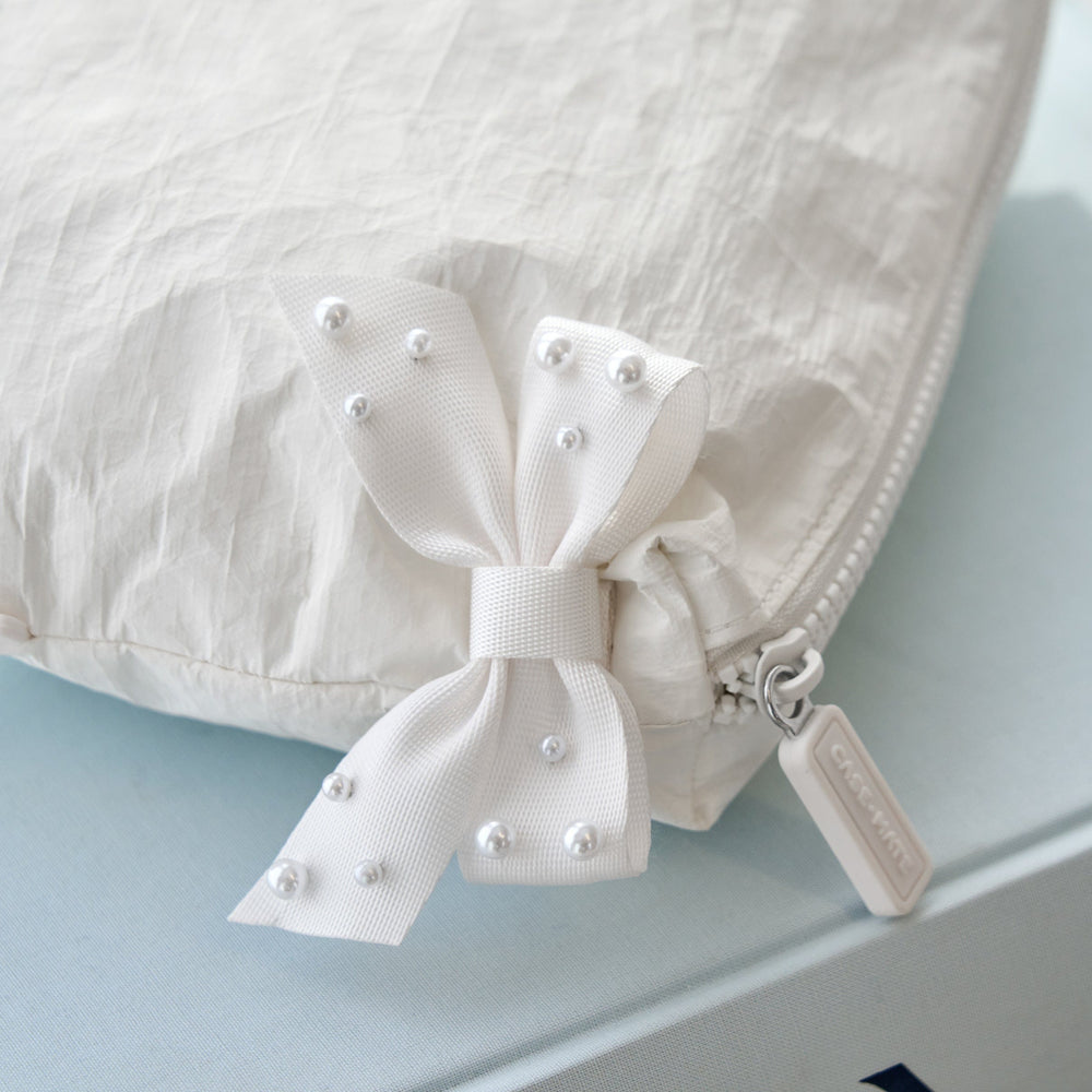 Close up of Ivory Pearl Crinkle Makeup Bag