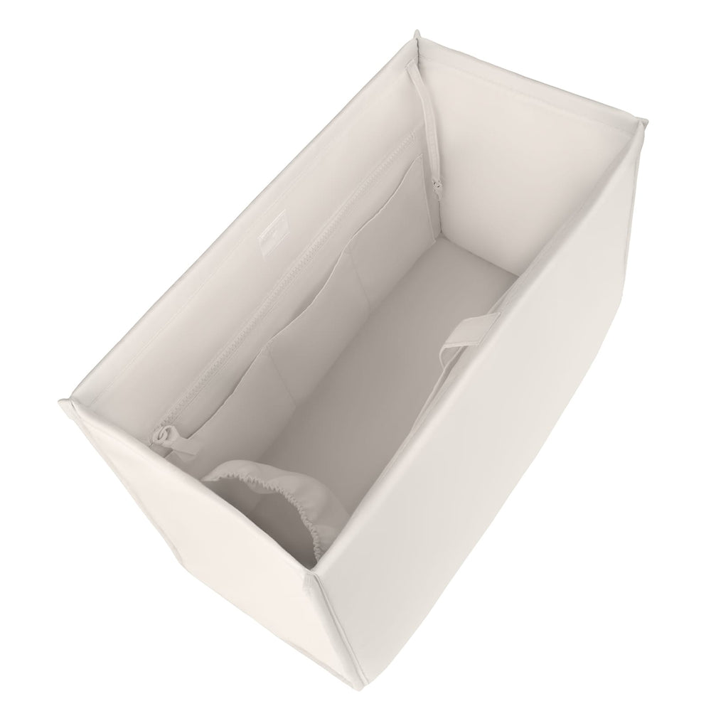 A white fabric diaper bag organizer insert shown from an elevated angle, displaying its interior pockets and compartments on a solid white background.
#color_french vanilla 