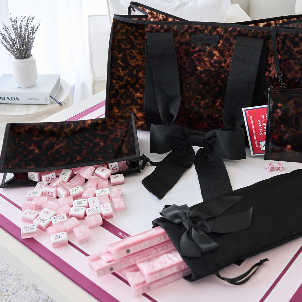 Tortoiseshell bow Mahjong Tote Set set up with the tiles, racks, and mat as props in the image. The tiles, racks, and mat are not included in the set #color_tortoiseshell bow
#color_tortoiseshell bow