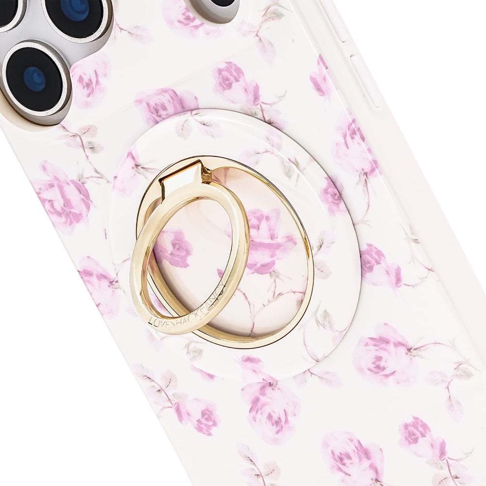 Gold ring holder on a phone case with pink floral pattern
#color_ribbon rosa flora