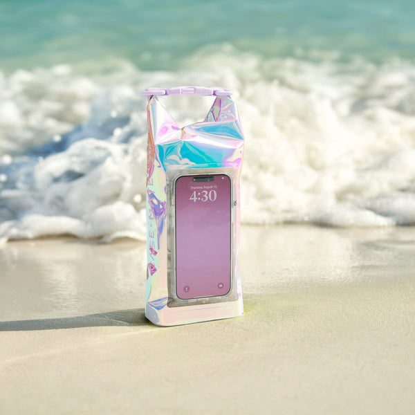 Phone case with a colorful, iridescent design on a beach
#color_iridescent