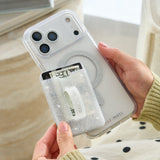 Person holding a phone case with a glittery design #color_twinkle