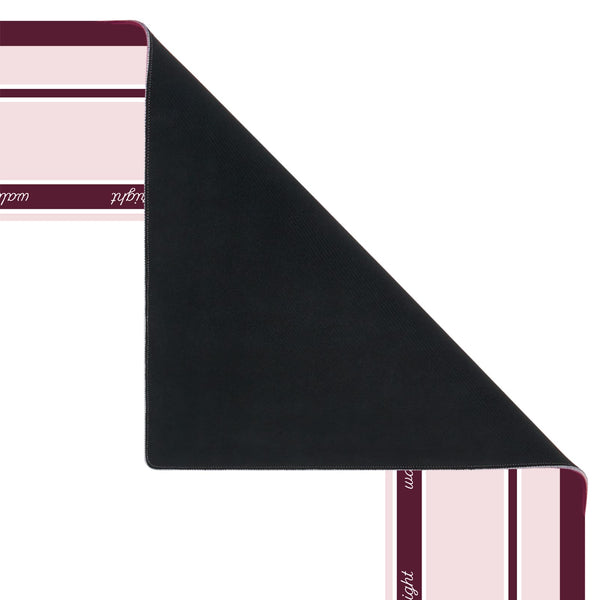 A folded black rectangular mat or pad shown on a white background, with partial striped pink and burgundy ends visible at the corners.
#color_classic ballet pink