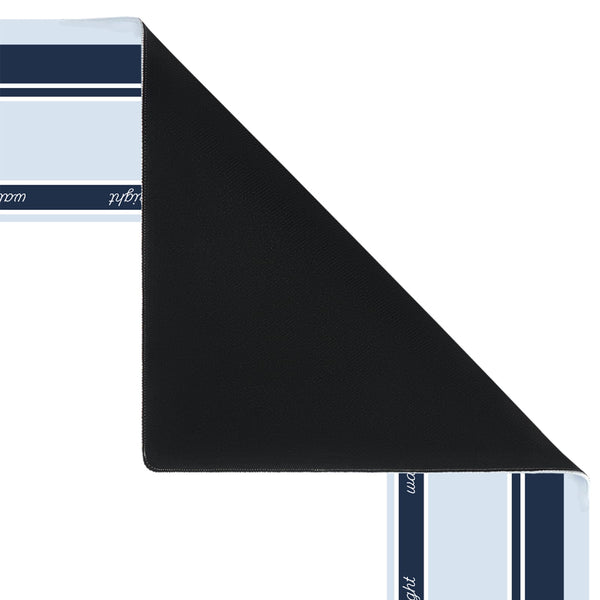 A folded black rectangular mat or pad shown on a white background, with a matching striped textile partially visible at the top left and bottom right edges.
#color_classic carolina blue