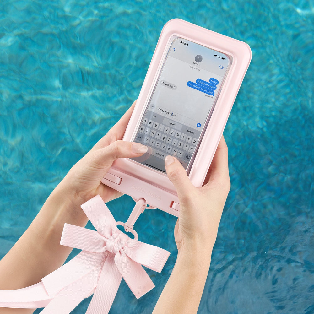 Person using a pink phone case with a stand feature by a pool.
#color_ballet pink bow