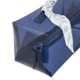 A navy blue translucent waterproof pouch bag with a floral-patterned white and blue scarf tied to its top handle, shown on a clean white background.
#color_something navy twilly