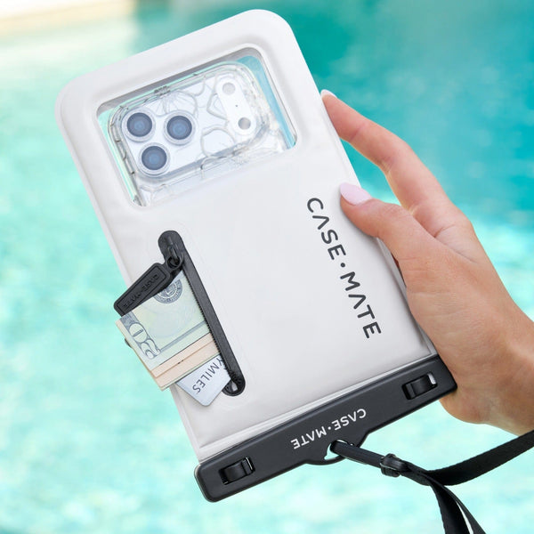 Hand holding a phone case with a pool background #color_sand dollar