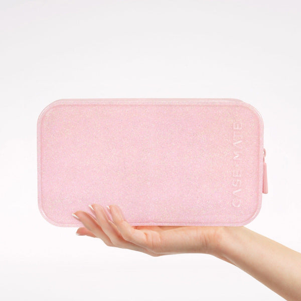 Pink rectangular pouch held in a hand against a white background #color_ballet pink twinkle