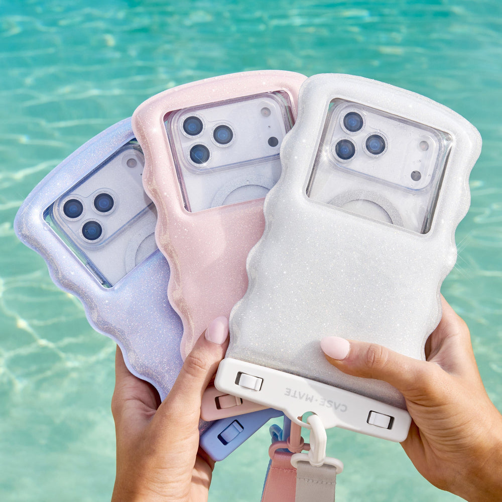 Three phone cases held by hands with a blurred water background #color_mist twinkle