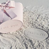 bottom of cooler with "case-mate" branding imprinted into the sand from the base of the cooler bag leaving a mark #color_ballet pink bow