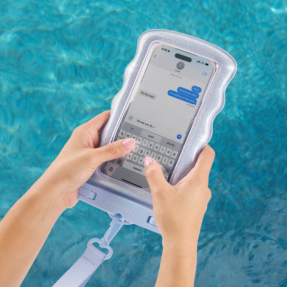 Person using a phone with a waterproof case in front of a pool. #color_mist twinkle