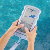 Person using a phone with a waterproof case in front of a pool. #color_mist twinkle