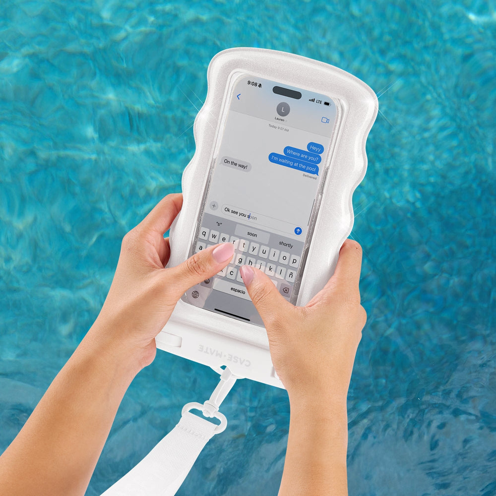 Person using a phone with a waterproof case by a pool #color_ivory twinkle