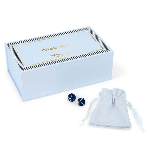 A light blue Case-Mate mahjong jolly box with gold lettering, shown with two dark blue dice and a matching light blue drawstring pouch on a clean white background.
#color_cabana stripe edition