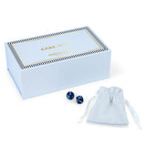 A light blue Case-Mate mahjong jolly box with gold lettering, shown with two dark blue dice and a matching light blue drawstring pouch on a clean white background.
#color_cabana stripe edition