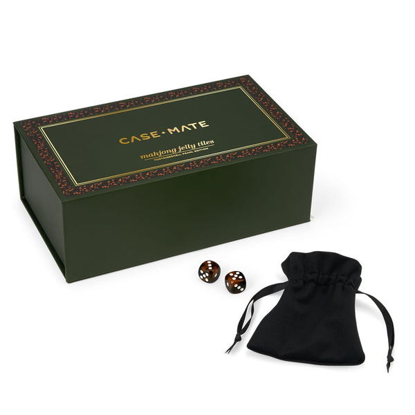 CASE+MATE Mahjong jelly tiles set with a dark green presentation box, two dark brown jelly tiles, and a black drawstring pouch on a white background.
#color_tortoiseshell pearl edition