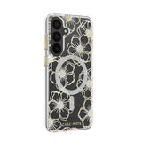 A clear phone case with a black background and a gold floral pattern, featuring a silver glitter circular MagSafe ring and the CASE•MATE brand name at the bottom.
#color_floral gems