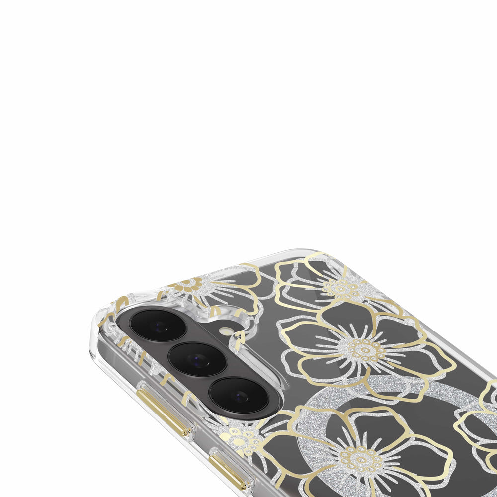 A close-up of a clear phone case with a metallic gold and silver glitter floral pattern, fitted on a smartphone with a dual-camera system, shown against a plain white background.
#color_floral gems