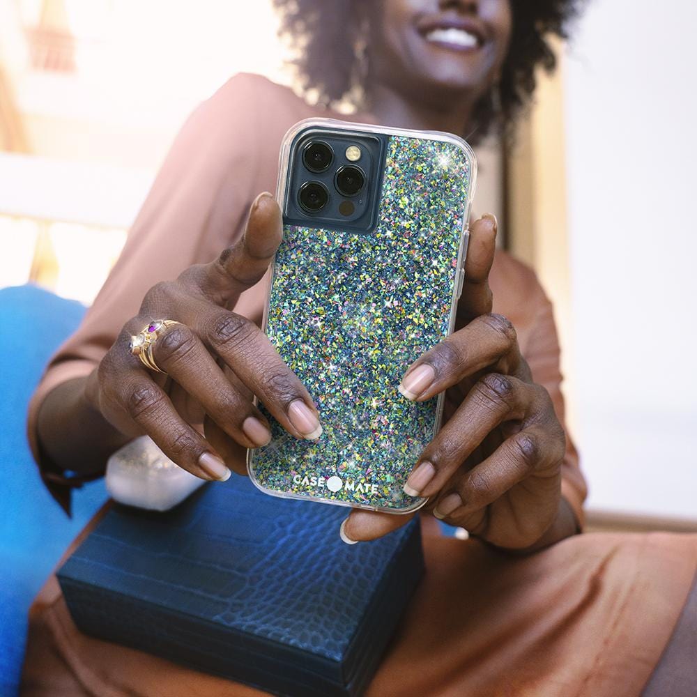 Woman holding multicolored sparkly case. color::Confetti