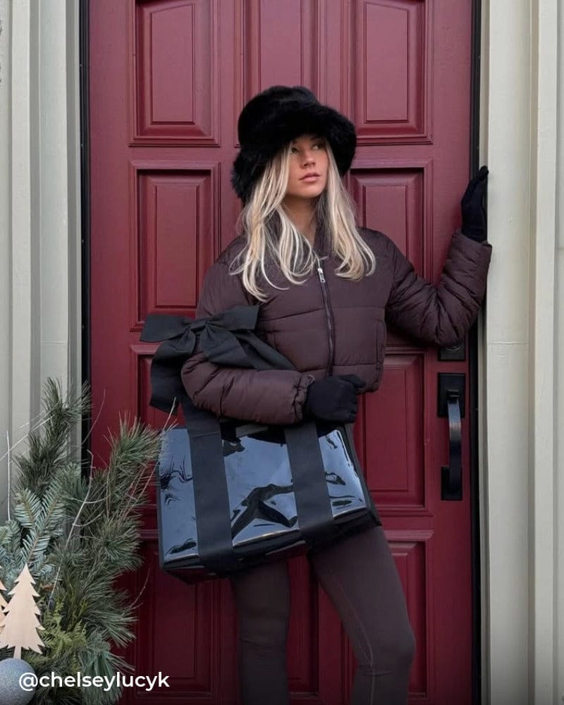 Girl carrying midnight black bow jelly tote