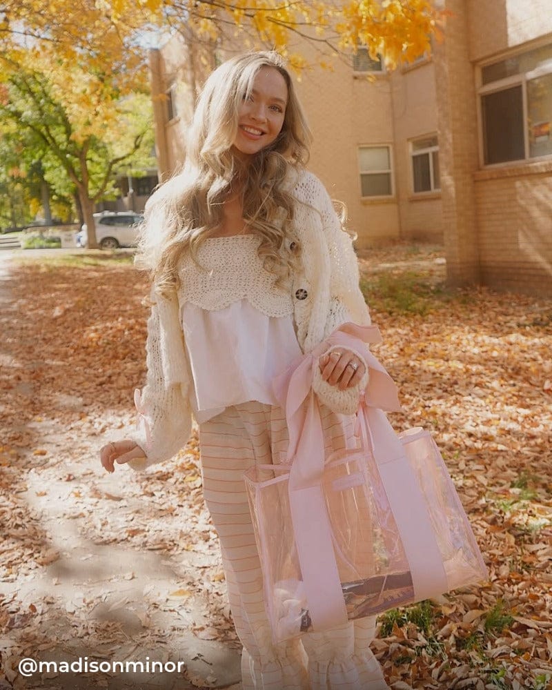 Girl outside holding Ballet Pink Bow Jelly Tote