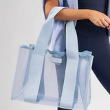 Light blue sheer tote bag held by a person on a light gray background
#color_carolina blue crochet wave
