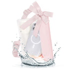 Belt bag on white background with phone and small accessories inside 
#color_ballet pink bow