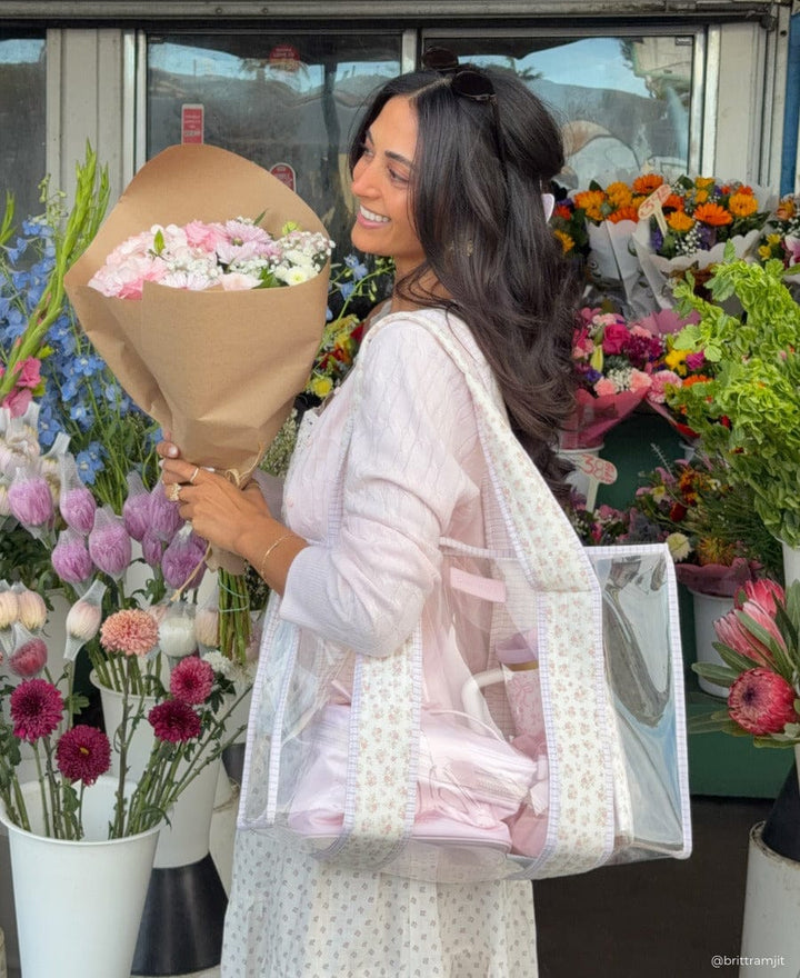 Girl holding a bouquet of flowing with Ditsy Quilted Floral Jelly Tote Bag