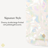 A close-up of a transparent iridescent phone case with holographic pastel reflections and gold branding, shown next to text reading 'Signature Style' and 'Dreamy, durable design finished with polished gold accents.'.

#color_opalite pearl