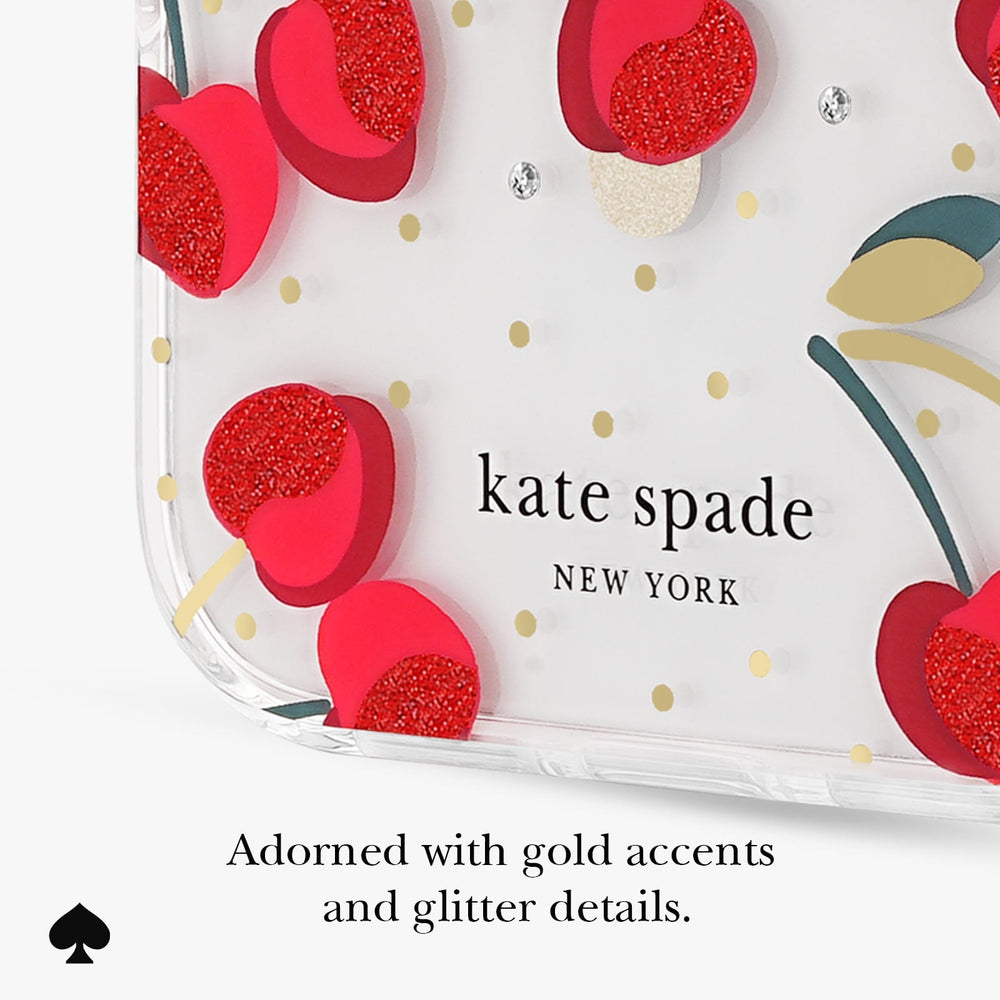 Kate Spade New York clear phone case featuring a red glittery cherry pattern, gold polka dots, and rhinestone embellishments, with text below reading 'Adorned with gold accents and glitter details.'.
#color_cherry dot