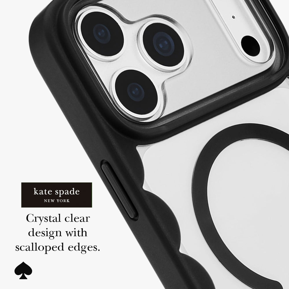 Kate Spade New York crystal clear phone case with black scalloped edges, shown fitted on a smartphone with a silver reflective back and black camera surround. Text on the image reads 'Crystal clear design with scalloped edges.
#color_scallop black
