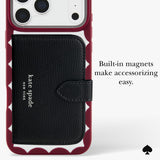 A Kate Spade New York phone case in burgundy and white with a built-in black leather card holder and wallet. The image includes text that reads 'Built-in magnets make accessorizing easy.
#color_scallop cherry glaze
