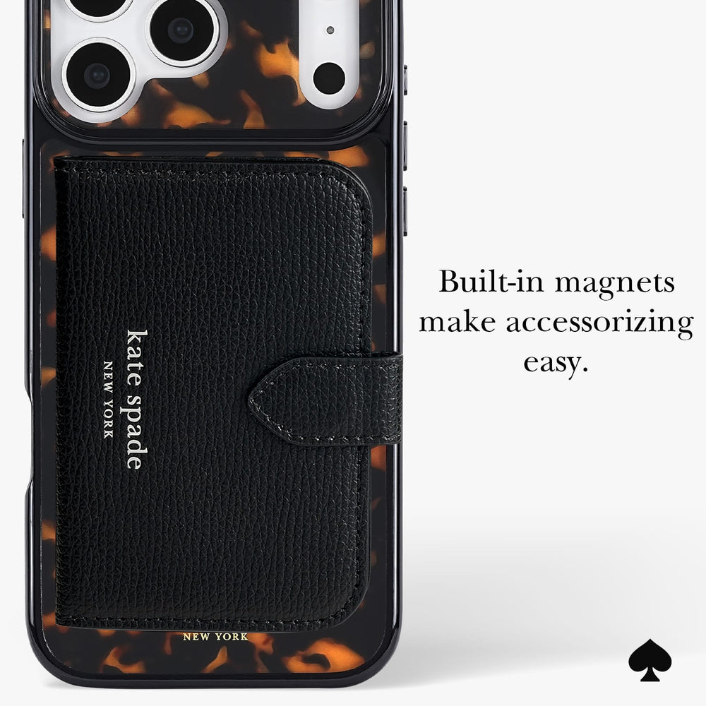 Kate Spade New York phone case with a built-in black leather card holder and white text logo, featuring a tortoiseshell pattern around the edges and camera cutout, with text on the right reading 'Built-in magnets make accessorizing easy.'.
#color_tortoise
