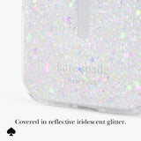 A close-up of a clear phone case covered in reflective iridescent glitter, with the Kate Spade New York logo debossed near the bottom. Text below reads, 'Covered in reflective iridescent glitter.
#color_chunky glitter