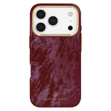 A Kendra Scott phone case in a textured deep burgundy leather finish with gold trim around the camera cutout and a gold logo at the bottom, shown on a white background.
#color_cherry lacquer pearl