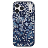 Kate Spade New York phone case featuring a navy blue background with a delicate floral pattern in shades of blue, white, and gray, with the brand name printed at the bottom.
#color_flowerbed navy