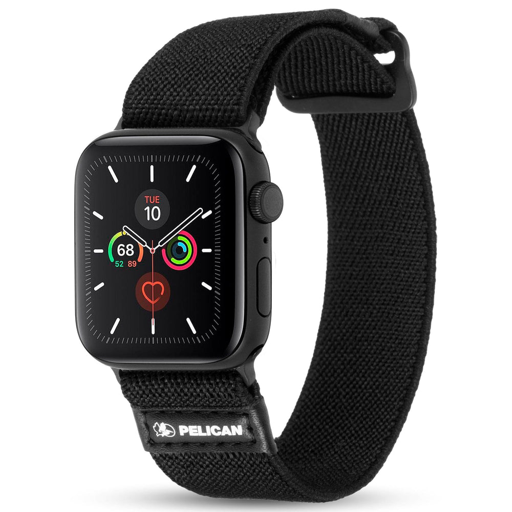 Black fabric Apple Watch band with textured weave material and Pelican logo patch on closure.