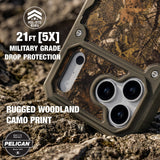 A rugged Pelican phone case with a woodland camouflage print and olive green trim, shown resting on rocky ground outdoors. The image includes promotional text highlighting 21 feet of drop protection and military-grade durability.
#color_shield elements hunter camo