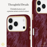 A close-up view of a phone case with a deep burgundy marbled texture, gold-toned camera ring, and gold side buttons. Text on the left reads 'Thoughtful Details' and describes tactile buttons and a precise camera control cutout.
#color_cherry lacquer pearl